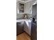 Sleek kitchen design with stainless steel appliances, bright cabinets, and modern fixtures at 911 Laramie Blvd # B, Boulder, CO 80304