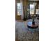 Bright living room featuring an area rug, hardwood floors, and natural light from large windows at 911 Laramie Blvd # B, Boulder, CO 80304