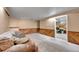 Finished basement boasts plush carpeting, wood paneled walls, and access to an office at 3451 Highland Pl, Westminster, CO 80031