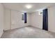 This bedroom offers carpet floors and two windows offering ample natural light at 3451 Highland Pl, Westminster, CO 80031