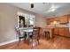 Eat-in kitchen features wooden cabinetry and dining area at 3451 Highland Pl, Westminster, CO 80031