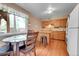 Eat-in kitchen with wooden cabinetry and modern appliances at 3451 Highland Pl, Westminster, CO 80031