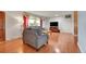 Cozy living room with hardwood floors and updated furnishings at 3451 Highland Pl, Westminster, CO 80031