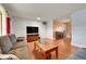 Spacious living room featuring wood floors, a large window, and comfortable furnishings at 3451 Highland Pl, Westminster, CO 80031