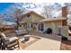 Backyard featuring an outdoor seating area, a fire pit, a stone patio, and a grill at 4179 E Peakview Cir, Centennial, CO 80121