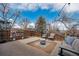 Backyard featuring an outdoor seating area, a fire pit, a playhouse and mature trees at 4179 E Peakview Cir, Centennial, CO 80121