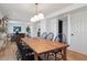 Bright dining room with hardwood floors and classic furnishings; spacious and open to the living area at 4179 E Peakview Cir, Centennial, CO 80121