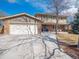 Charming two-story home with a well-manicured lawn, attached two car garage and inviting front porch at 4179 E Peakview Cir, Centennial, CO 80121