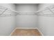 Walk in closet with built-in shelving and carpeted floor at 2235 Alyssa St, Fort Lupton, CO 80621
