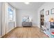 Bright living room with hardwood floors and a large window for natural light at 601 Tenderfoot Dr, Berthoud, CO 80513