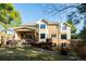 Expansive backyard with lush lawn, mature trees, covered patio, a hot tub and a multi-level deck perfect for outdoor entertaining at 924 Glen Oaks Ave, Castle Pines, CO 80108