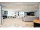 Spacious finished basement featuring a cozy fireplace, built-in shelves and cabinetry, and comfortable seating area at 924 Glen Oaks Ave, Castle Pines, CO 80108