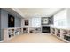 Finished basement with built-in shelving, cozy fireplace and recessed lighting throughout the room at 924 Glen Oaks Ave, Castle Pines, CO 80108