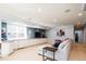 Basement featuring a comfortable sectional, custom cabinetry, large windows and recessed lighting at 924 Glen Oaks Ave, Castle Pines, CO 80108