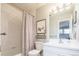 Bright bathroom featuring a tub with shower, tiled walls, and modern fixtures at 924 Glen Oaks Ave, Castle Pines, CO 80108