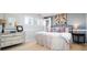 A cozy bedroom with neutral colors, a metal bed frame, and decorative artwork at 924 Glen Oaks Ave, Castle Pines, CO 80108