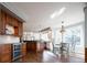 Spacious kitchen with a wine cooler, dark wood cabinetry, and stainless steel appliances at 924 Glen Oaks Ave, Castle Pines, CO 80108