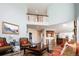 Spacious living room with hardwood floors and an open floor plan with sight lines into the kitchen at 924 Glen Oaks Ave, Castle Pines, CO 80108