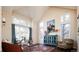 Elegant living room with large windows, hardwood floors, and vaulted ceiling, providing a comfortable space at 924 Glen Oaks Ave, Castle Pines, CO 80108
