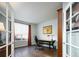 Bright office space with hardwood floors, a desk, and French doors at 924 Glen Oaks Ave, Castle Pines, CO 80108
