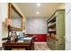 Cozy home office featuring custom cabinetry, bright wallpaper, recessed lighting and tile flooring at 924 Glen Oaks Ave, Castle Pines, CO 80108