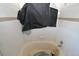 Bathroom with white tile and a bathtub partially covered by a black tarp at 1631 W Canal Cir # 832, Littleton, CO 80120