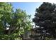 Three-story condo with double balconies nestled amongst mature trees at 1631 W Canal Cir # 832, Littleton, CO 80120