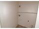 Small laundry room area with hook-ups, shelf, and vent at 1631 W Canal Cir # 832, Littleton, CO 80120
