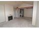 Bright living room features a cozy fireplace and damaged ceiling at 1631 W Canal Cir # 832, Littleton, CO 80120