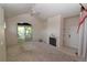 Inviting living room with vaulted ceiling, fireplace, and sliding glass doors to the outside at 1631 W Canal Cir # 832, Littleton, CO 80120