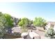Scenic view of neighboring rooftops with lush trees from a window at 1631 W Canal Cir # 832, Littleton, CO 80120