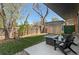 Backyard featuring a patio with a fire pit, chairs, artificial grass and shade at 5240 N Raleigh St, Denver, CO 80212