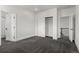 A bedroom with two large closets, neutral-toned carpet flooring and easy access to the bathroom at 5240 N Raleigh St, Denver, CO 80212