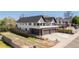 Exterior view of a two-story home featuring a brick garage and a paved driveway at 5240 N Raleigh St, Denver, CO 80212