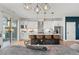 Modern kitchen with island seating, pendant lights, and stainless appliances at 5240 N Raleigh St, Denver, CO 80212