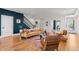 Open-concept layout with living, dining, and staircase featuring modern design at 5240 N Raleigh St, Denver, CO 80212