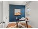 Cozy office with a stylish desk, unique chair, and a window providing natural light, creating an inviting workspace at 5240 N Raleigh St, Denver, CO 80212