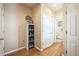 Inviting hallway with neutral walls, modern decor, and warm wood floors at 7080 Simms St # 105, Arvada, CO 80004