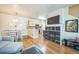 Comfortable living area with an open layout, fireplace, and adjacent dining and kitchen spaces at 7080 Simms St # 105, Arvada, CO 80004