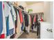 Spacious walk-in closet with plentiful hanging space, shelving, and stacked drawers for optimal storage at 7080 Simms St # 105, Arvada, CO 80004