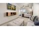 Spacious bedroom featuring comfortable seating, built-in wall accents, and ample natural light, perfect for relaxation and rest at 17637 W 87Th Ave, Arvada, CO 80007