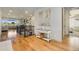 Entryway with wood floors, console table, painting and staircase leading to an open living area at 17637 W 87Th Ave, Arvada, CO 80007