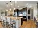 Modern kitchen with stainless steel appliances, granite countertops, and a spacious island at 17637 W 87Th Ave, Arvada, CO 80007