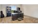 Bright and spacious home office area with a large desk and bookshelves at 17637 W 87Th Ave, Arvada, CO 80007