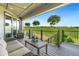 Covered patio showcasing views of the surrounding greenery and planters, with comfortable seating for relaxation and outdoor enjoyment at 17637 W 87Th Ave, Arvada, CO 80007