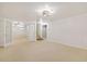Open basement with carpet, recessed lighting, and stairs to main floor at 937 S Cole Dr, Lakewood, CO 80228