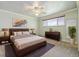 Comfortable bedroom featuring neutral decor, a large window for natural light, and modern furnishings at 937 S Cole Dr, Lakewood, CO 80228