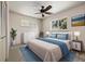 Inviting bedroom with a large window, ample closet space, soft lighting, and cozy decor with blue accents at 937 S Cole Dr, Lakewood, CO 80228