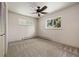 Neutral bedroom featuring wall to wall carpeting, windows, and a ceiling fan at 937 S Cole Dr, Lakewood, CO 80228