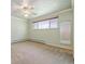 Bedroom with neutral paint, carpet, ceiling fan and single window at 937 S Cole Dr, Lakewood, CO 80228